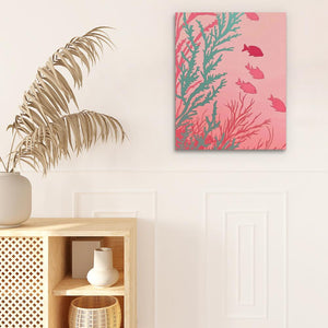 a pink and green painting on a wall next to a plant