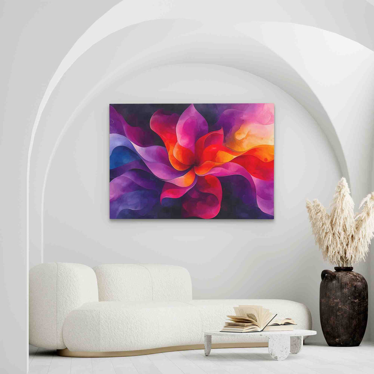 a living room with a white couch and a painting on the wall