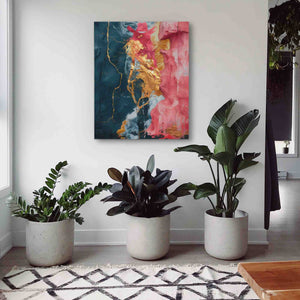 three potted plants sit in front of a painting on the wall