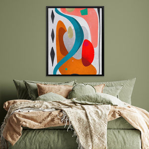 a bed with a green comforter and a painting on the wall