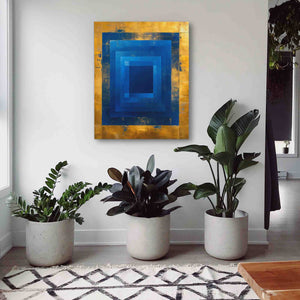 three potted plants in front of a painting on a wall