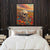 a painting of a skull on a wall above a bed