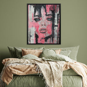 a painting of a woman's face on a green wall above a bed