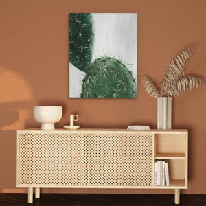 a painting of a cactus on a wall